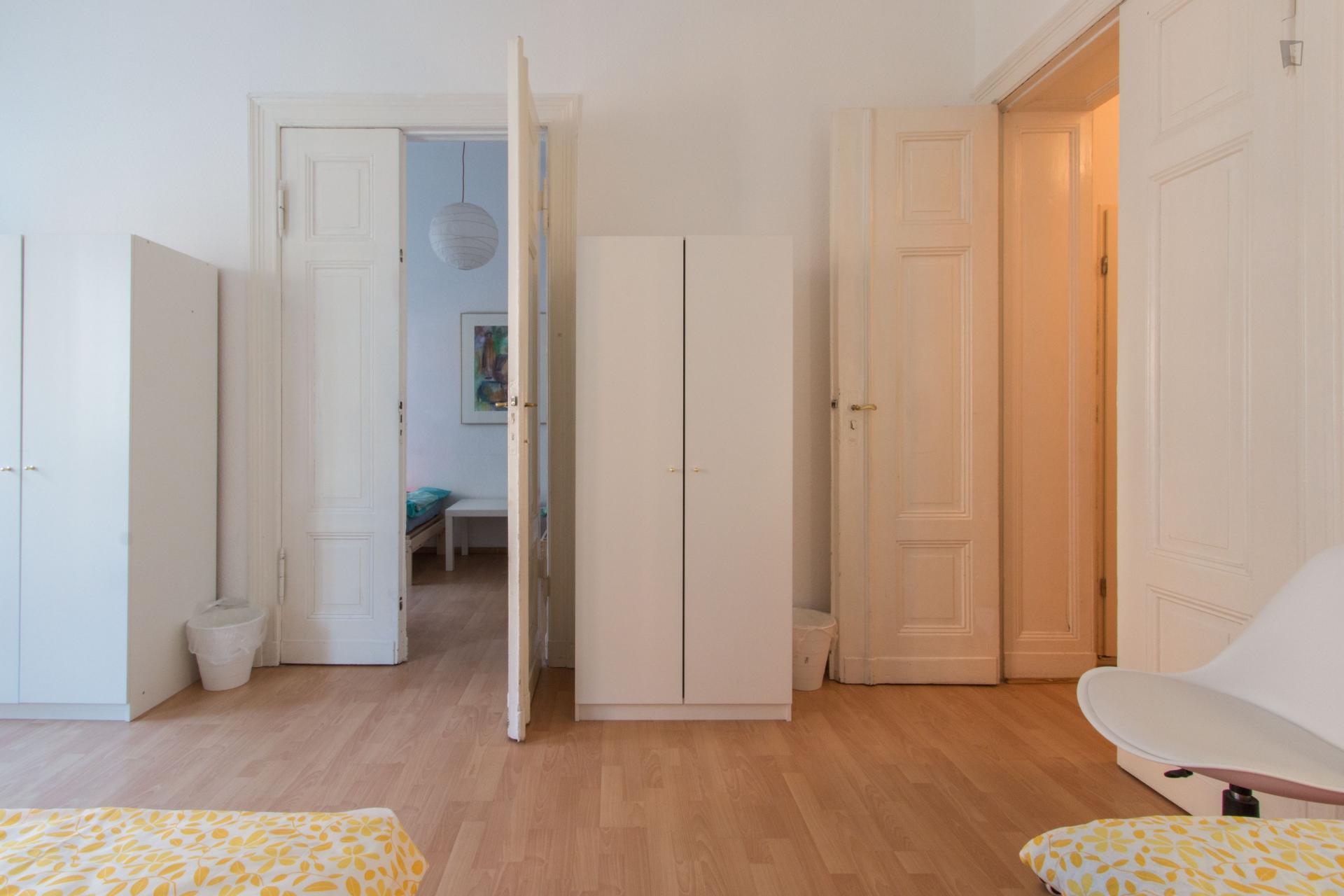 Bed in triple bedroom in Tiergarten