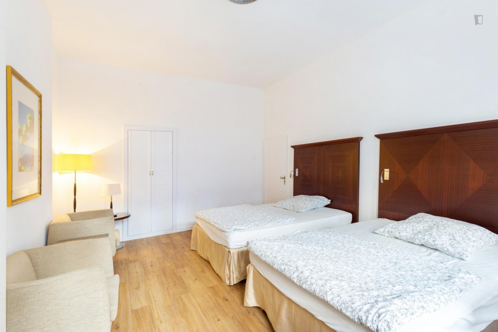 Bed in a homely twin bedroom, in Wedding