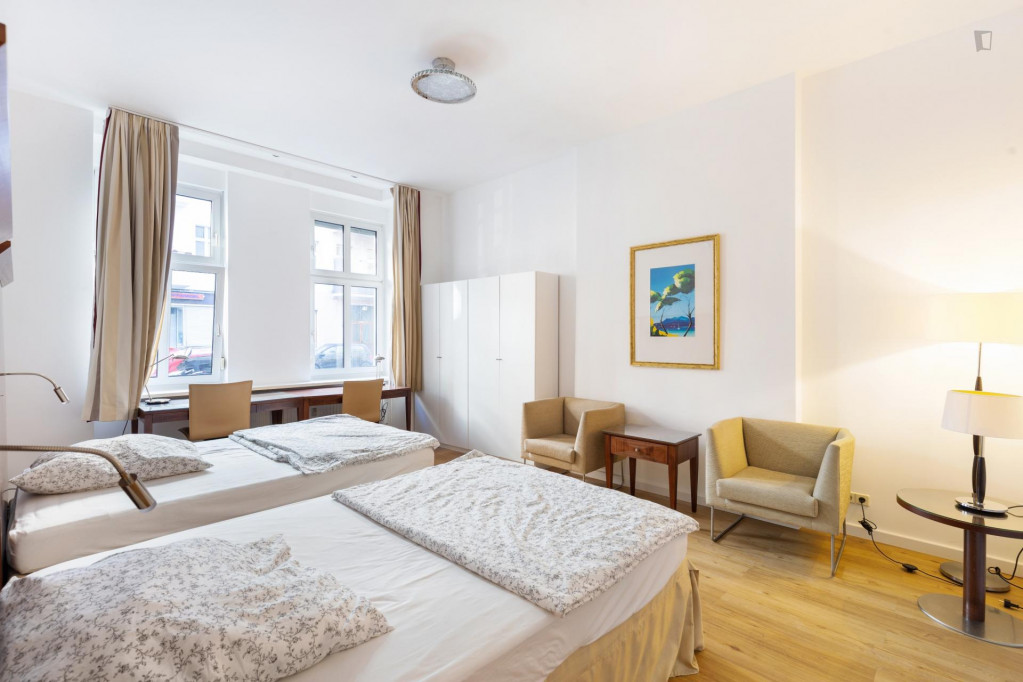 Bed in a homely twin bedroom, in Wedding