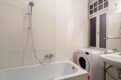 Single bedroom with TV in a 3-bedroom apartment